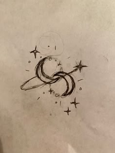 a pencil drawing of the letter s with stars coming out of it's center