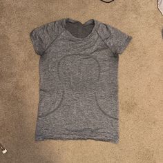 Grey Lululemon Athletic Shirt Lululemon Gray Shirt, Where To Buy Cheap Preppy Clothes, Lululemon Grey Shirt, Athletic T Shirts, Lululemon T Shirt, Grey Lulu Shirt, Grey Lululemon Shirt, Cute Athletic Outfits For School, Eminem Daughter