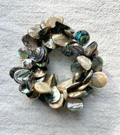 This gorgeous and sophisticated Abalone shell bracelet goes beautifully with just about any outfit, alone or paired with matching earrings or necklace. Perfect for fancy occasions or just a day or night when you need a little extra bling! Abalone Shell Bracelet, Shell Bracelet, Wedding Jewelry Bracelets, Cord Bracelet, Pretty Bracelets, Cord Bracelets, Abalone Shell, Wedding Bracelet, Matching Earrings