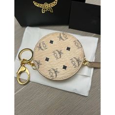 Nwt Mcm Beige Visetos Canvas Round Coin Purse Wallet And Key Chain $205. 100% Authentic Color: Multi / Beige Coated Canvas Black Visetos Logo Patterni Zip Coin Compartment Golden Hardware One Mcm Engraved Key Ring And One Dog Leash Key Ring Measures 3.5" X 3.5" Made In Korea Luxury Bags With Key Leash, Chic Bags With Logo Charm For Everyday, Luxury Bags With Key Leash For Everyday Use, Round Coin Purse, Mcm Bags, Coin Purse Wallet, Keychain Bag, Dog Leash, Purse Wallet