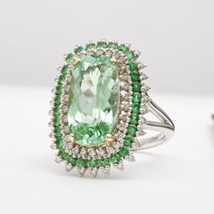 Eye clean and spectacular, this 6.83 carat green tourmaline mined in Namibia will be a great choice to make an impression. Handcrafted in 14K white gold, this ring studded with a halo of diamonds and tsavorites, will take everyone by storm.  Order online info@jupitergem.com Light Mint Green, Detailed Ring, Green Tourmaline, Yellow Gold Rings, Diamond White, Types Of Metal, Tourmaline, Halo, Gold Metal