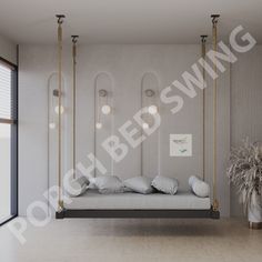 a bedroom with a swing bed and hanging lights in the corner, along with a potted plant