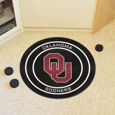 the university of nevada las vegas rug is on the floor next to black and white circles