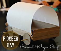 a wooden wagon made out of toilet paper