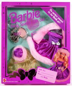 the barbie doll is wearing a purple dress