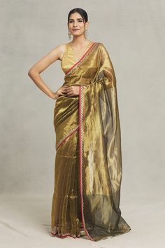 Gold saree with red contrast and gold lace, thread, sequin embellishment on border. - Aza Fashions Festive Pre-draped Organza Saree With Gota Work, Gold Chanderi Pre-draped Saree With Gota Work, Gold Pre-draped Saree With Sheer Dupatta For Navratri, Gold Organza Pre-draped Saree With Resham Embroidery, Gold Organza Pre-draped Saree For Navratri, Transitional Gold Pre-draped Saree With Gota Work, Gold Anarkali Pre-draped Saree With Sheer Dupatta, Gold Pre-draped Saree With Resham Embroidery For Reception, Fitted Gold Pre-draped Saree For Festive Occasions