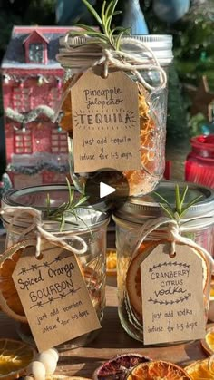 jars filled with dried oranges and spices on top of a table