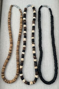 Handmade from coconut shell beads. 3 colors available; natural (tan), black, and multicolor 20" length. Beaded Brown Shell Necklace As Gift, Brown Beaded Shell Necklace For Gifts, Brown Necklaces With Black Beads For Beach, Coconut Necklace, Adjustable Brown Handmade Shell Necklace, Coconut Shell, Natural Tan, Shell Beads, Shell Necklaces