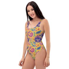 Inspired by the iconic Indian teardrop-shaped motif, our one-piece swimsuit is a chic addition to your beach wardrobe! Featuring vibrant shades of purple, yellow, blue, and pink, it's a contemporary interpretation of traditional Paisley design. Make a statement by the shore while paying homage to the rich heritage of Indian culture!This one-piece swimsuit for all figures will bring out your best features. Enjoy the smooth fabric and the flattering design, and show it off by the sea or pool! Country Wall Clock, Beach Wardrobe, Make Waves, Indian Culture, Swimsuits For All, Paisley Design, Crop Sweatshirt, Blue And Pink, By The Sea