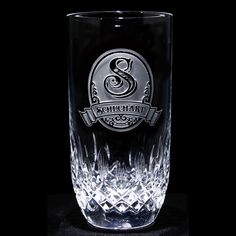 an old fashioned glass with the letter s on it