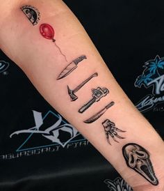 a person with a tattoo on their arm holding a red balloon and some knives in it