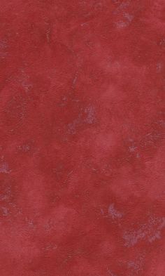 an image of a red background that looks like it has been dyed with some paint