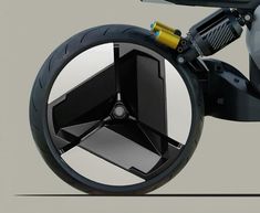 the rear wheel of a motorcycle is shown with its reflection in it's side mirror