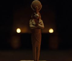 a small figurine holding a baby in its arms