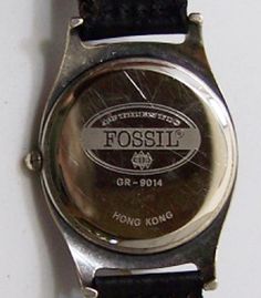 Vintage collectible Fossil watch in excellent unworn vintage condition. Part of a series of watch releases that commemorates America's innovations in aviation and transportation history. Classic quality design with three dimensional pewter airplane against a world globe background on an antiqued silver tone case. Comes on a new Fossil genuine black woven leather vintage band in excellent unworn condition. Comes in a vintage Fossil collectible tin with airplane theme. ( may not be the one shown) Vintage Silver Watch With Analog Display, Silver Analog Display Watch For Collectors, Silver Analog Display Watches For Collectors, Vintage Silver Automatic Watch Accessories, Vintage Silver Analog Watch Accessories, Vintage Silver Watch Accessories With Tachymeter, Globe Background, Airplane Theme, World Globe