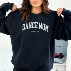 This dance mom sweatshirt is a wonderful dance mom gift!  Or get it for yourself as it's the perfect ballet mom shirt to support your favorite ballerina! PRODUCT DETAILS Unisex adult crewneck sweatshirt 50% cotton, 50% polyester Direct-To-Garment printed (inks are water-based, bio-degradable and non-toxic) Medium-heavy fabric (8.0 oz/yd² (271.25 g/m CARE INSTRUCTIONS Please follow the care instructions below to prolong the life of your new shirt! Machine wash cold (max 30C or 90F) inside out Tum Cotton Hip Hop Sweatshirt For Dance Class, Casual Relaxed Fit Sweatshirt For Dance Class, Relaxed Fit Sweatshirt With Letter Print For Dance Class, Relaxed Fit Letter Print Sweatshirt For Dance Class, Casual Letter Print Sweatshirt For Dance, Casual Cotton Sweatshirt For Dance, Letter Print Sweatshirt For Dance Class In Fall, Long Sleeve Letter Print Sweatshirt For Dance Class, Crew Neck Sweatshirt With Letter Print For Dance