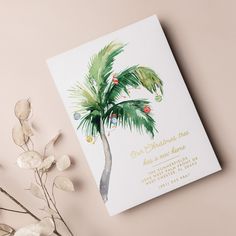 a wedding card with a watercolor painting of a palm tree