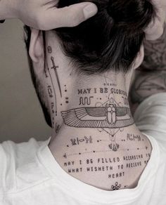 a man with a neck tattoo that has writing on it