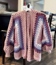 This cute oversized cardigan is 100% handmade and fits like a women's L/XL. The oversized fit is cozy and perfect for fall/winter. You're bound to get compliments in this one-of-a-kind piece!  The sleeve cuffs are slightly tighter, but should stretch over time as worn. Hand wash and air dry. Handmade Cozy Sweater Coat For Fall, Cozy Handmade Sweater Coat For Fall, One Size Fall Crochet Cardigan, Cozy Crochet Sweater Coat For Fall, Handmade Oversized Sweater Coat For Fall, Cozy Crochet Outerwear One Size, Cozy Oversized Crochet Outerwear, Cozy Crochet Sweater For Fall, Oversized Crochet Sweater Coat For Fall