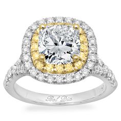 a fancy yellow diamond ring set in 18k white gold