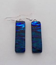 "I fused 2 layers of glass to create this gorgeous earring ,,dichroic glass and clear glass on the top. The size is 1/4\" by 1 1/4\" .All my jewelry come in a nice gift box." Nickel-free Rectangular Czech Glass Jewelry, Czech Glass Rectangular Earrings For Gift, Rectangular Czech Glass Earrings For Gifts, Glass Drop Earrings For Gift, Unique Glass Jewelry With Matching Earrings, Czech Glass Jewelry With Matching Earrings For Gifts, Czech Glass Jewelry Set With Matching Earrings As Gift, Iridescent Czech Glass Drop Earrings, Handmade Iridescent Czech Glass Earrings