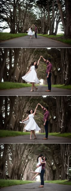 a man and woman dancing in the middle of a road surrounded by trees with their arms outstretched