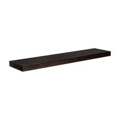 a wooden shelf sitting on top of a white wall