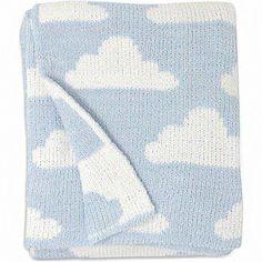 a blue blanket with white clouds on it