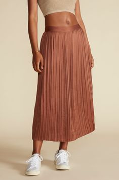 The effortlessly chic Blaze Skirt, pleated to perfection, is a timeless classic—pairs beautifully with a casual t-shirt or cozy sweater. Pleated, midi-length, a-line skirt Flat front band and elastic at back waist for fit  Self-linedMade from 100% GPS-certified recycled polyester (Global Recycled Standard)32" in lengthEthically Made in ChinaPart of a Matching Set M Cafe, Skirt Pleated, Cozy Sweater, Casual T Shirt, Cozy Sweaters, Timeless Classic, A Line Skirt, Casual T Shirts, Matching Sets