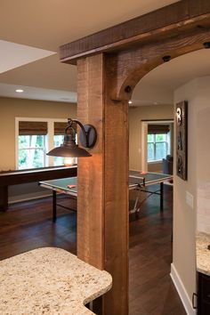 an open kitchen and dining room with a pool table