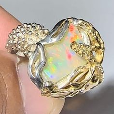 Ethiopian Handmade Sterling 925 Opal Ring Ring Size: 9 Weight Ring: 45.05ct Opal Size: 14.1mm X 8.0mm X 4.6mm Descubra la belleza única de las piedras de ópalo Etíope. Sumérgete en un mundo de color y brillo inigualable con estas gemas de origen Etíope. Cada piedra es una obra maestra de la naturaleza, con patrones y tonos que te dejarán sin aliento. ¡Atrévete a lucir la elegancia y originalidad de las piedras de ópalo etíope en tus joyas! ¡No se conforme con lo ordinario, luzca con estas piedra Luxury Silver Opal Ring, Hallmarked, Luxury Silver Opal Ring Hallmarked, Dazzling Opal Gemstone Ring Gift, Luxury Silver Opal Jewelry, Luxury Silver Opal Ring, Silver Opal Ring With Prong Setting For Gift, Unique White Gold Opal Ring Gift, Luxury Untreated Jewelry For Anniversary, Elegant Anniversary Opal Ring