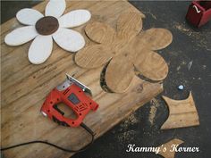 a piece of wood that has been cut into flower shapes with a power tool on it