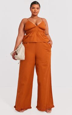 Enter the new season in style with these plus burn orange linen look frayed hem wide leg pants. Brought to you in a burnt orange linen look material with a frayed hem design and a wide leg fit, what more could you need Pair these wide leg pants with the matching top, heels and statement gold accessories for a look that is sure to make heads turn wherever you go.   Length approx 90cm/31.5 (Based on a sample size UK 16)   Model wears size UK 16/ EU 44/ AUS 16/ US 12 Bridal Lingerie Honeymoon, Wide Leg Pants High Waisted, Burn Orange, Wide Leg Pants Plus Size, Outfit Dinner, All Black Dresses, High Waisted Wide Leg Pants, Plus Size Bridesmaid, Bodycon Dresses Casual