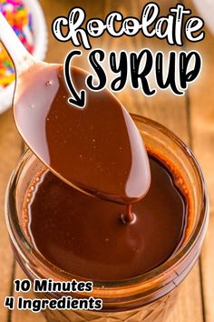 chocolate syrup is being poured into a jar with the words chocolate syrup in it and on top