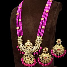 Most beautiful gold replica pachi work  pendent set with beads  look.very grand and real one perfect for a Indian bridal Gold Kundan Chandbali Beaded Necklaces, Diwali Kundan Beaded Temple Jewelry Necklace, Pink Temple Jewelry For Puja, Pink Kundan Temple Necklace For Festivals, Pink Kundan Temple Necklace With Meenakari, Traditional Yellow Gold Beaded Necklaces, Pink Meenakari Kundan Temple Necklace, Traditional Pink Kundan Temple Necklace, Pink Temple Necklace For Diwali