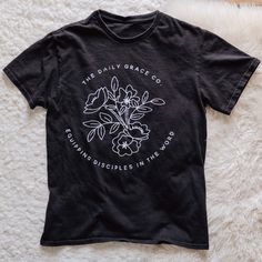 This is a black t-shirt.Fits true to size. Size up if you would like a more relaxed fit. Reminder For Yourself, Daily Grace Co, Daily Grace, Tan T Shirt, She Loves You, Night Out Outfit, Shirt Fits, The Gospel, Black T Shirt