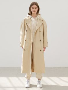 Editor's NotesThe overfit trench coat in rustling nylon has a classic lapel design featuring cow horn buttons with the Neueyet logo, double-button closure, waistbelt the same fabric, belt rings, and cuff button decorations. Also, it is unique with relaxed raglan sleeves and a round shoulder line, making it stylish to wear in spring and early fall. - Rustling nylon - Overfit- Classic lapel design- Double-button closure- Waistbelt the same fabric, belt rings, and cuff button decorat Lapel Design, Belt Ring, Button Decorations, Cow Horns, Early Fall, Fabric Belt, Raglan Sleeve, Horn, Trench Coat