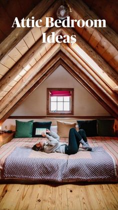 a person laying on top of a bed in a loft