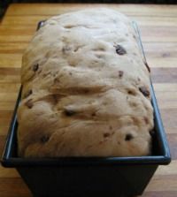 a loaf of bread sitting on top of a wooden table