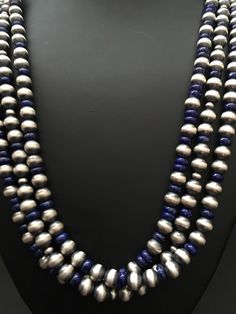 sterling silver lapis 3 strand bead necklace. The necklace measures 22 inch. Silver Multi-strand Jewelry With Spacer Beads, Sterling Silver Multi-strand Beaded Jewelry, Silver Lapis Lazuli Jewelry With Polished Beads, Silver Lapis Lazuli Necklace With Polished Beads, Silver Lapis Lazuli Necklace With Gemstone Beads, Lapis Lazuli Gemstone Beads Necklace In Silver, Silver Lapis Lazuli Gemstone Beads Necklace, Silver Double Strand Gemstone Bead Jewelry, Silver Multi-strand Beaded Necklace With Gemstone Beads