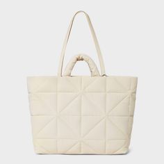 This Kate Tote Handbag from A New Day™ in a solid color showcases an unstructured silhouette with a geometric quilted finish for a chic, textured look and it goes well with any of your outfits. The interior accessories pocket, zip pocket and exterior side pockets help keep your belongings organized. Designed with a magnetic closure, this stylish tote handbag is easy to carry with double shoulder and grab handles. A New Day™: Style that goes wherever you do. Knitting Tote, Work Tote, Zip Tote, Tote Handbag, Nylon Bag, Cozy Fashion, Christmas Wishlist, A New Day, Mommy And Me