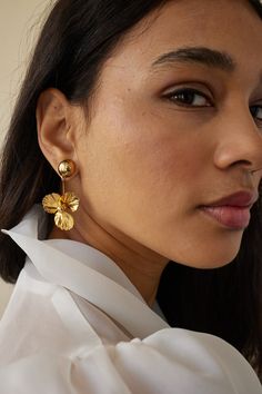 Gleam with sophistication wearing these classic Poppy Bauble Earrings. Handcrafted from 14 karat gold-plated domed studs, they feature an exquisite poppy flower design that evokes a modern, ethereal look. Perfect for any occasion, these earrings will add a touch of timeless luxury to your outfit. Hypoallergenic. Made to order. Poppy Flower Design, Hang Earrings, Lelet Ny, Timeless Luxury, Fabric Headbands, Hanging Earrings, Poppy Flower, Here Comes The Bride, Fine Jewellery