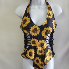 New Black 1 Piece Covered In Sunflowers. Lattice Sides. Pad In Bra. Ties Behind Neck. Pit To Pit 17". Waist 14" Side To Side. New, Never Worn. (Box S) Yellow Printed Bodysuit For The Beach, Yellow Stretch Swimwear With Floral Print, Yellow Printed Beachwear Bodysuit, Yellow Summer Bodysuit For Beach, Summer Yellow Bodysuit For Beach, Yellow Floral Print One-piece Swimwear, Trendy Yellow One-piece Bodysuit, Yellow Beachwear Bodysuit For Party, Yellow Summer Bodysuit