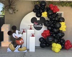 mickey mouse party decorations and balloon arch