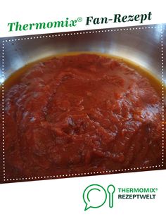 thermomiia pan - receipt is shown in front of a metal bowl filled with red sauce