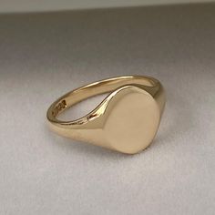 Pre - Owned Vintage British Jewellery Vintage 1940s 9ct yellow gold classic oval signet ring  Ring size - (This ring can be re-sized. Please contact for a quote) UK - V US - 10 1/2 # Hand engraving available #  Please contact for a quote! Metal - Solid 9ct yellow gold - Polished finish Face size - 13.2mm x 11.7mm  Weight - 5.52g Hallmark - Maker - ACCo, Metal - 9.375, Assay - Birmingham, Date - 1944 Overall condition - Excellent!    The signet ring comes in a lovely vintage style ring box! This British Jewellery, Oval Signet Ring, Jewellery Vintage, Vintage Style Rings, Us Size 10, Solid Metal, Ring Ring, Vintage Jewellery, Hand Engraving