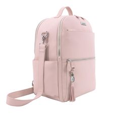 a pink backpack with zippers and tasselled straps on the front, sitting against a white background