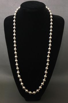 Vintage Sterling Silver Classic Beads Long Chain Necklace, beautiful design. It can double rope wear. Very Good pre-own condition. Stamped "STERLING" mark on clasp.  Length: 30'' (76 cm) long;  Bead size: 4mm, 10 mm Weight: 59 grams   Item is exactly as shown in pictures.   Please carefully review the item description and accompanying pictures before making a purchase, as we do not offer a return or exchange policy. If you have any questions or require assistance, please do not hesitate to reach out to us.   Check my store link to find more treasures:   https://galaxysilvercity.etsy.com Elegant Silver Beaded Necklaces Hand-strung, Elegant Silver Hand-strung Beaded Necklaces, Classic Jewelry With Beaded Chain And Round Beads, Classic Jewelry With Beaded Round Chain, Classic Jewelry With Round Beads And Beaded Chain, Classic Necklaces With Round Beaded Chains, Classic Single Strand Chain Necklace With Round Beads, Classic Single Strand Necklace With Round Beads, Silver Beaded Chain Jewelry For Formal Occasions