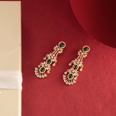 Description: Add elegance and charm to your look with this pair of stunning earrings. The Luz earrings are one of our most unique designs. Hand-crafted with the highest quality of gold plating and the most precious CZ stones, the Luz earrings are breathtaking. This will make a lovely Valentine's Day gift to your loved ones. Details & Specifications:Materials used: Brass Alloy with Yellow Gold platingWeight – Earring-20.5 gmLength – Earring-6.2 cmMake it customWant to make it a custom earring? Su Cz Earrings, Custom Earrings, Stunning Earrings, Cz Stone, Jewelry Trends, Valentine Day Gifts, Beautiful Jewelry, Jewelry Box, Unique Designs