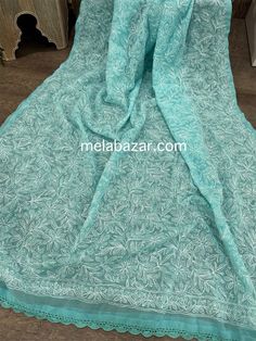 Beautiful and lightweight Chikankari hand embroidered geoDupatta with crochet lace. Blue Chikankari Embroidered Georgette Fabric, Green Cotton Dupatta With Intricate Embroidery, Blue Cotton Dupatta With Intricate Embroidery, Traditional Blue Embroidered Fabric With Lace Work, Traditional Blue Dupatta With Lace Work, Unstitched Chikankari Embroidered Lace Fabric, Traditional Chikankari Embroidered Lace Fabric, Unstitched Lace Fabric With Chikankari Embroidery, Chikankari Embroidered Lace Saree Fabric